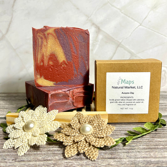 Handcrafted soap bar with a decorative box on a wooden surface